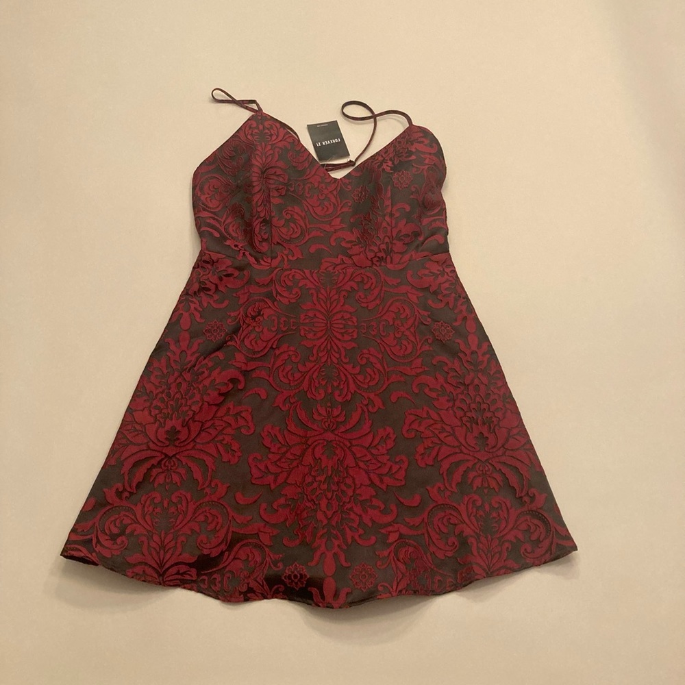 The brand is forever 21 , it’s Matte black with red velvet details, it’s medium